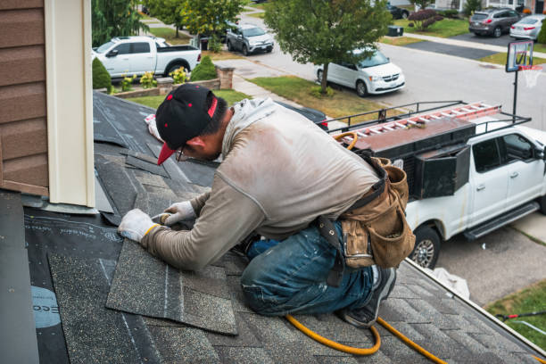 Professional Roofing technician working in Houlka, MS